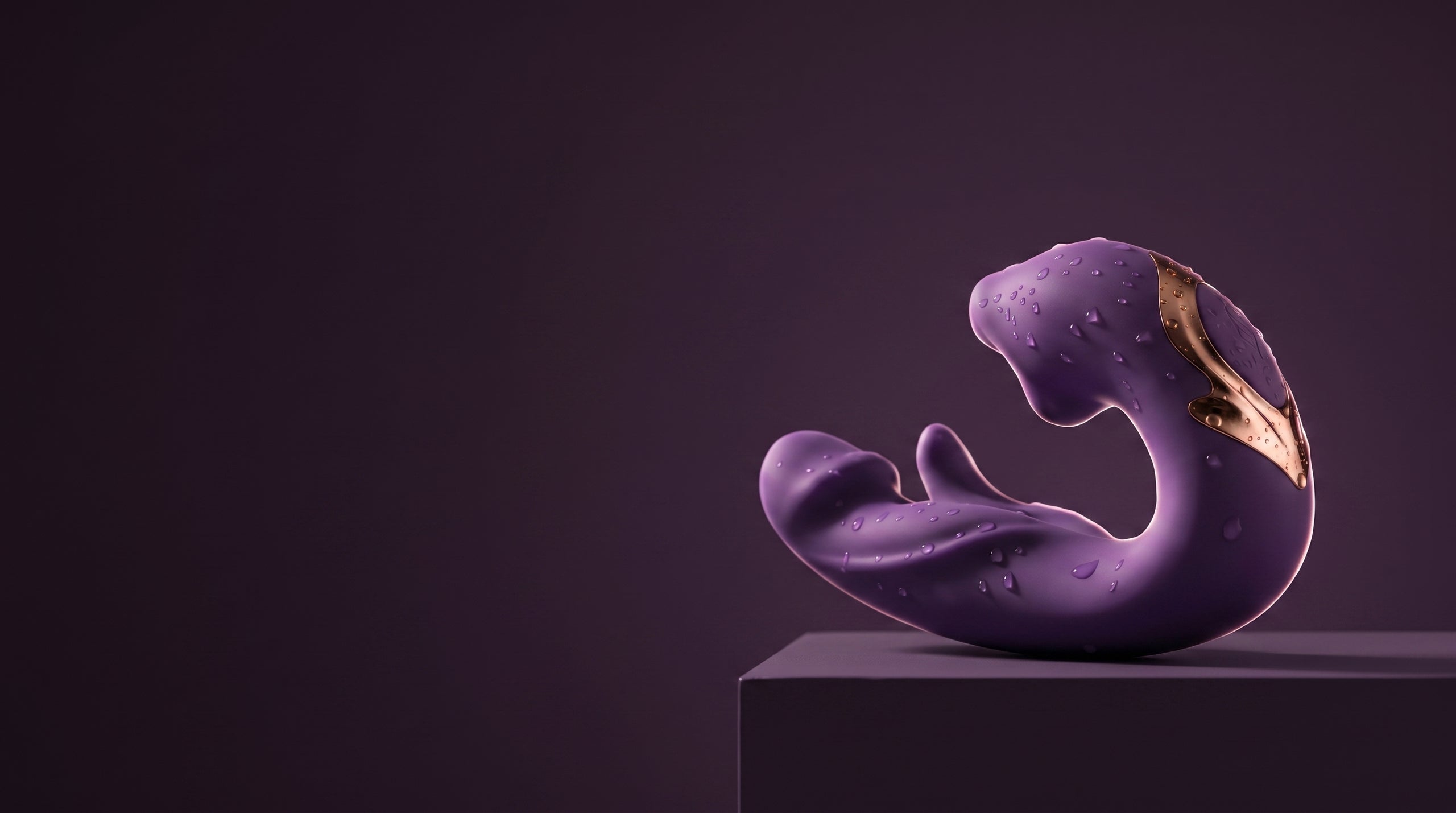Purple ÉLAN with water droplets on a plum display plinth