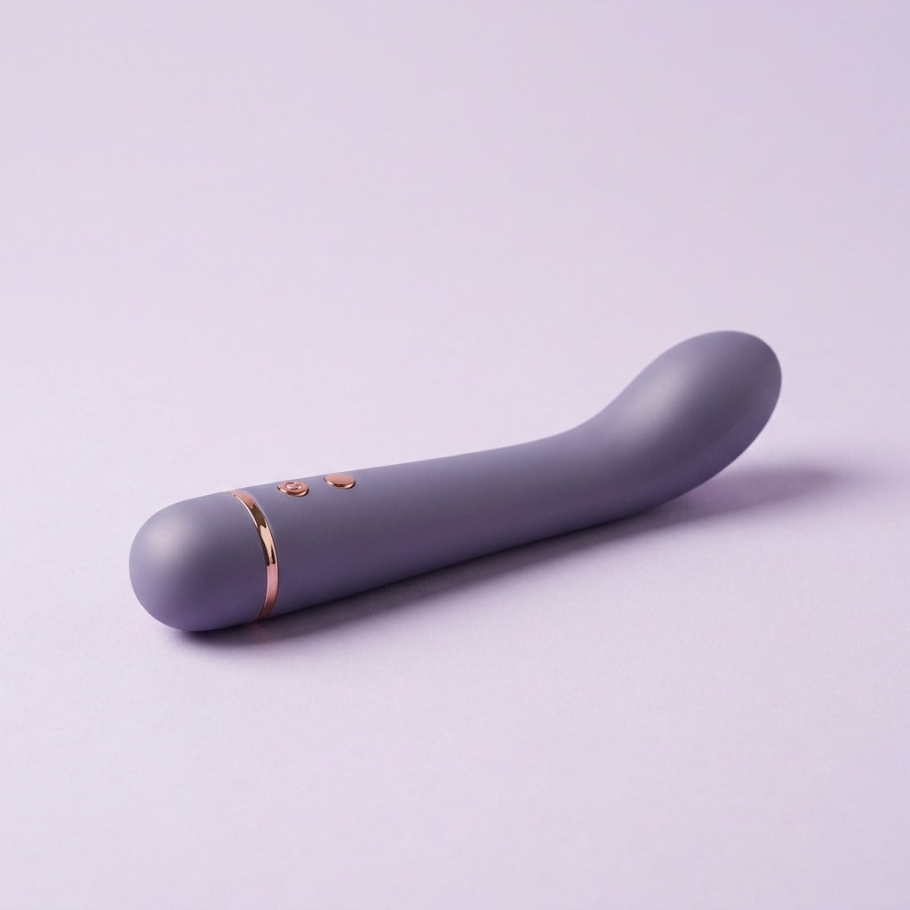 DOVIAR ARC curved G-spot vibrator with rose-gold buttons, on a lilac background