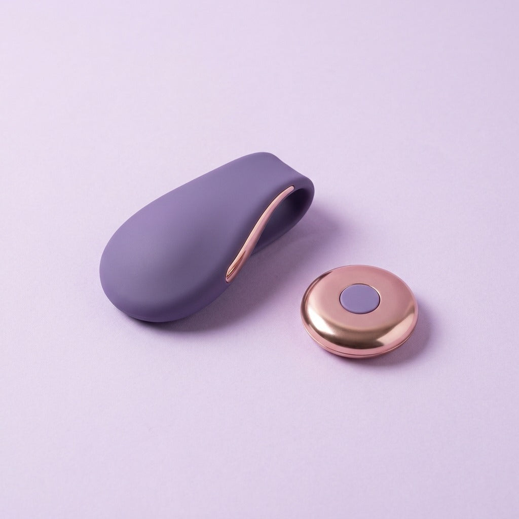 DOVIAR SECRET wearable vibrator beside its round rose-gold remote