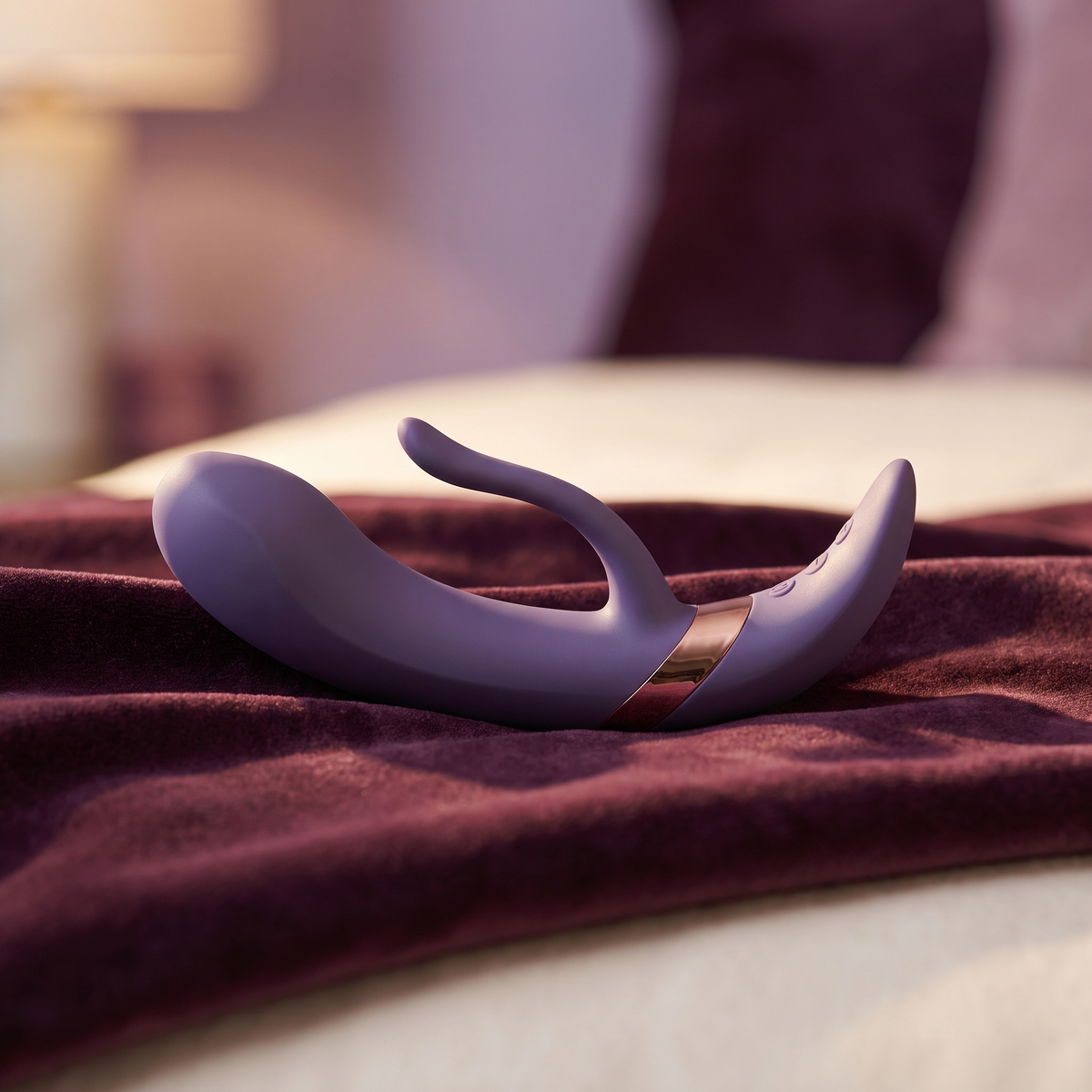DOVIAR LUNE dual rabbit vibrator on a plum velvet throw